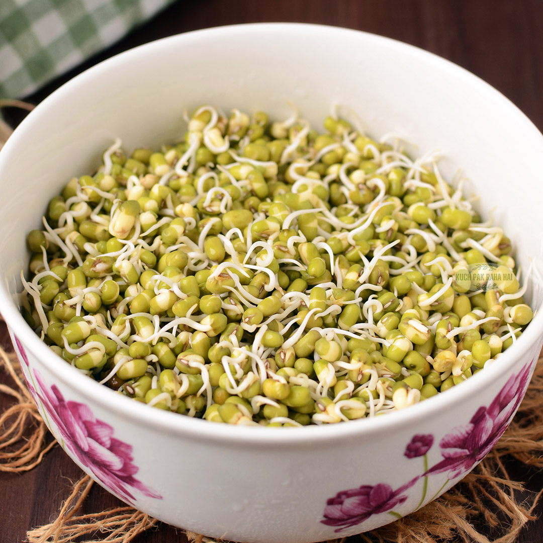 Sprouted green gram in a white bowl.