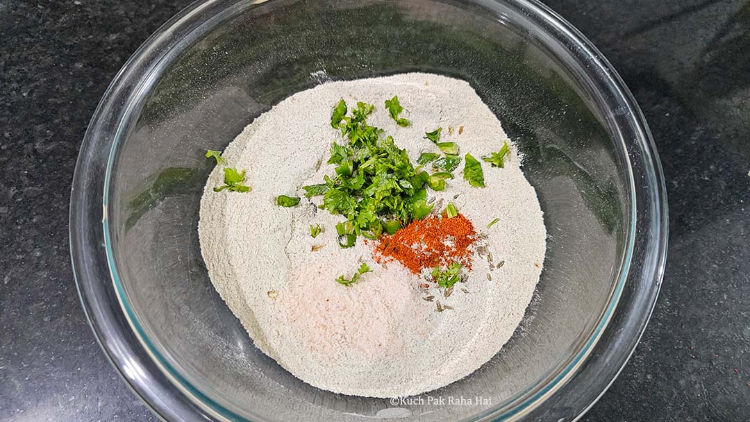 Mixing kuttu ka aata with spices.