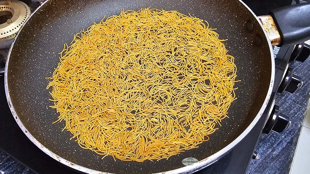 Roasting vermicelli or semiya in a pan.