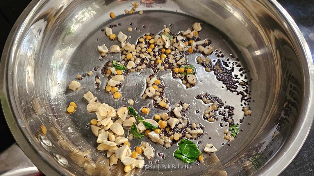 Sautéing mustard seed nuts in oil.