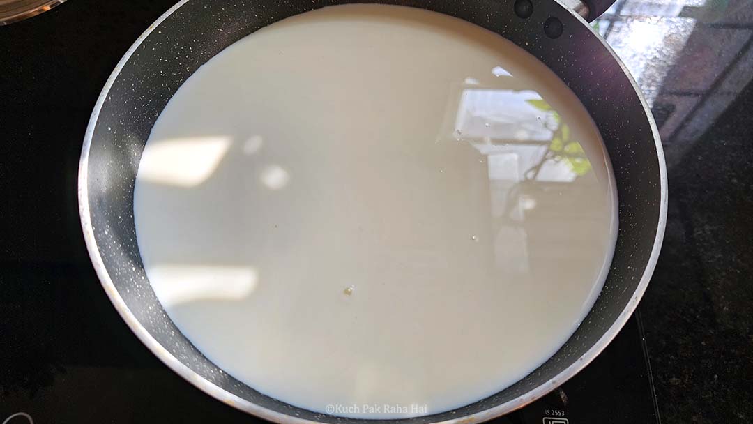 Heating milk in a pan.