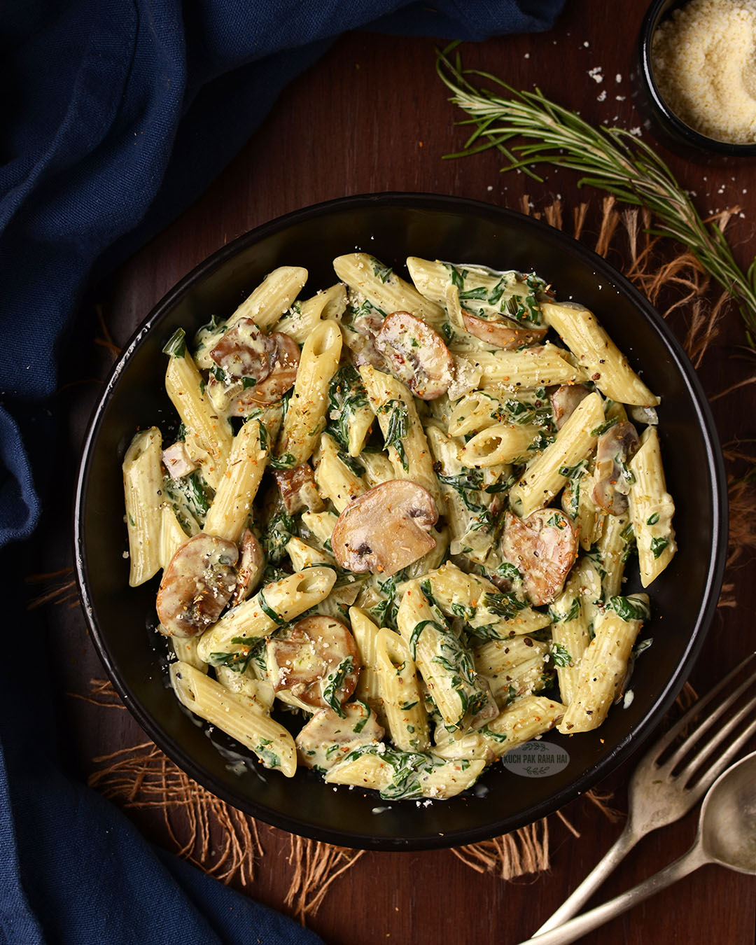 Mushroom pasta with spinach and onion.