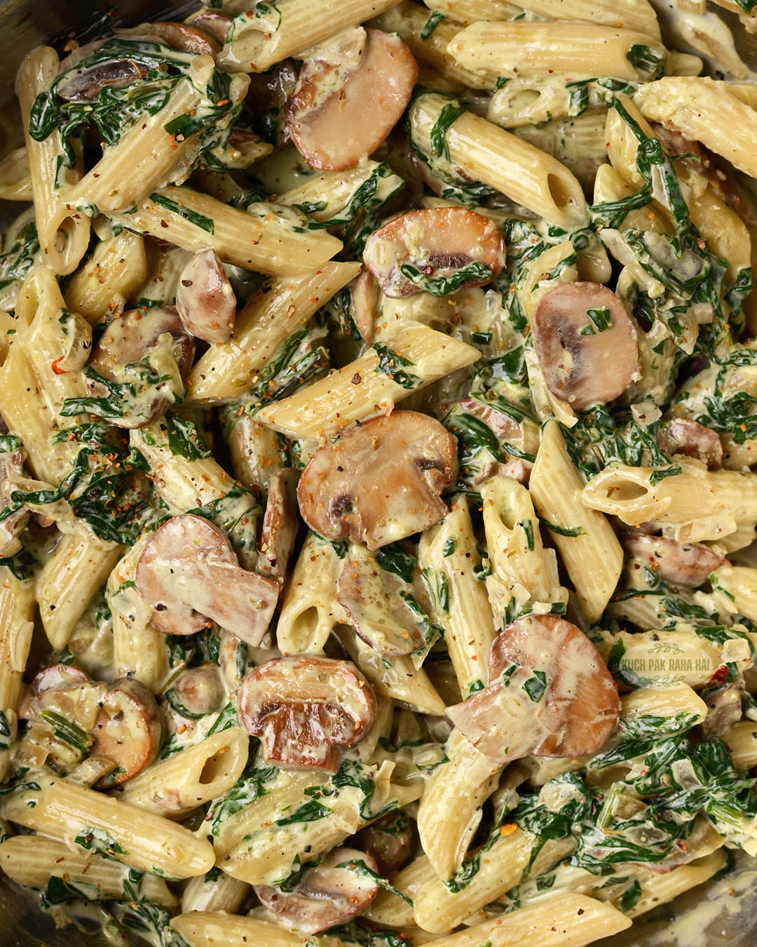 Pasta with mushrooms and spinach.