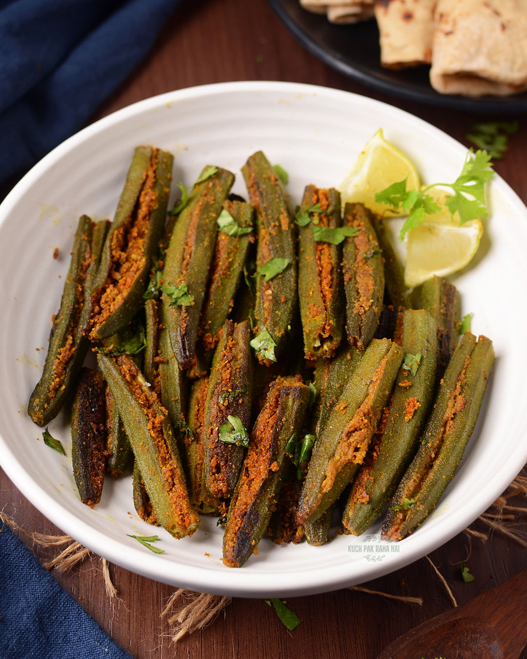 Stuffed okra fry served with roti.