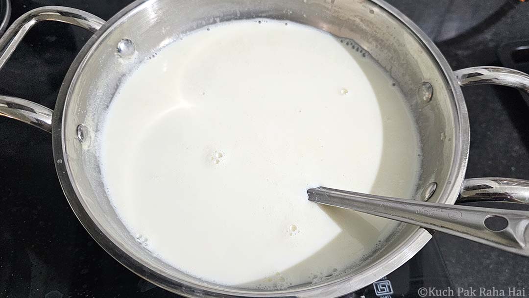 Boiling milk rice in pot.