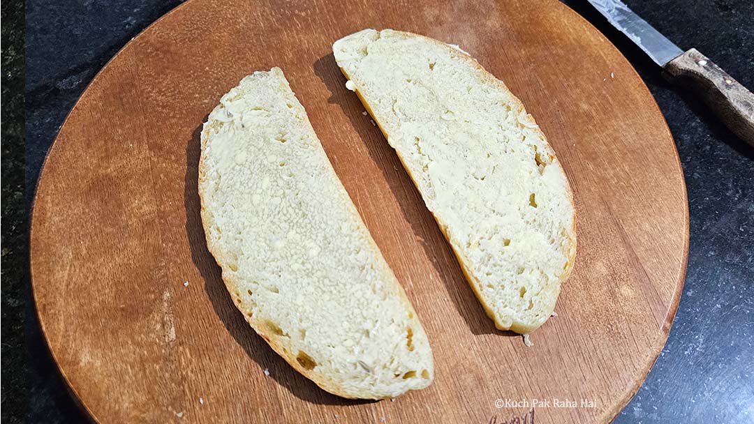 Spreading butter on bread slices.