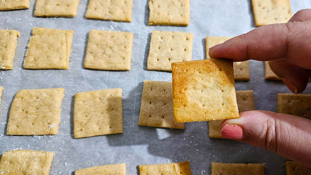 Checking back side of crackers.