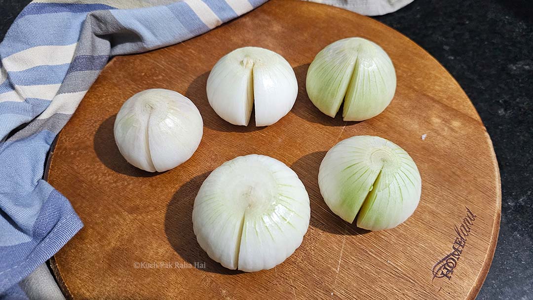 Partially cutting onions before cooking.