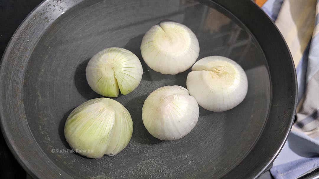 Boiling onions in a pot.