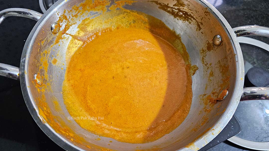 Simmering the curry in a pan.