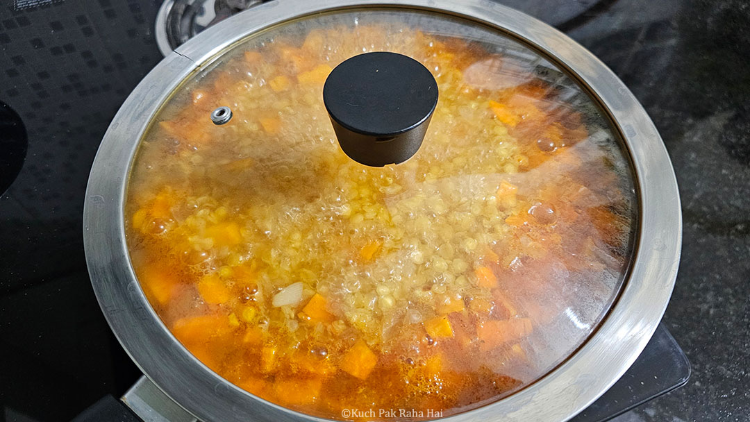 Simmering the soup on stovetop.