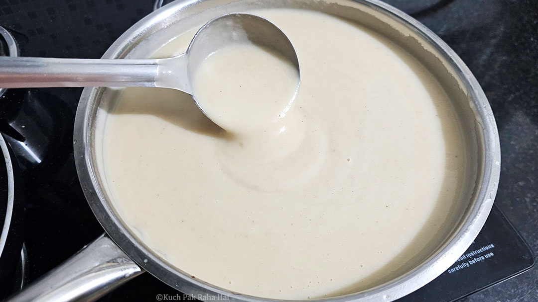 Simmering cauliflower soup in pan.