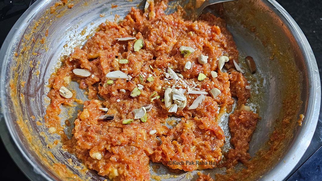 Carrot halwa garnished with nuts.