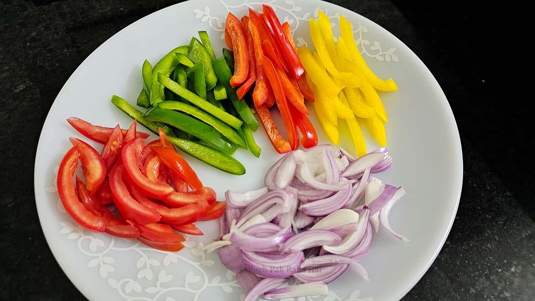 Cutting mixed vegetables into juliennes.